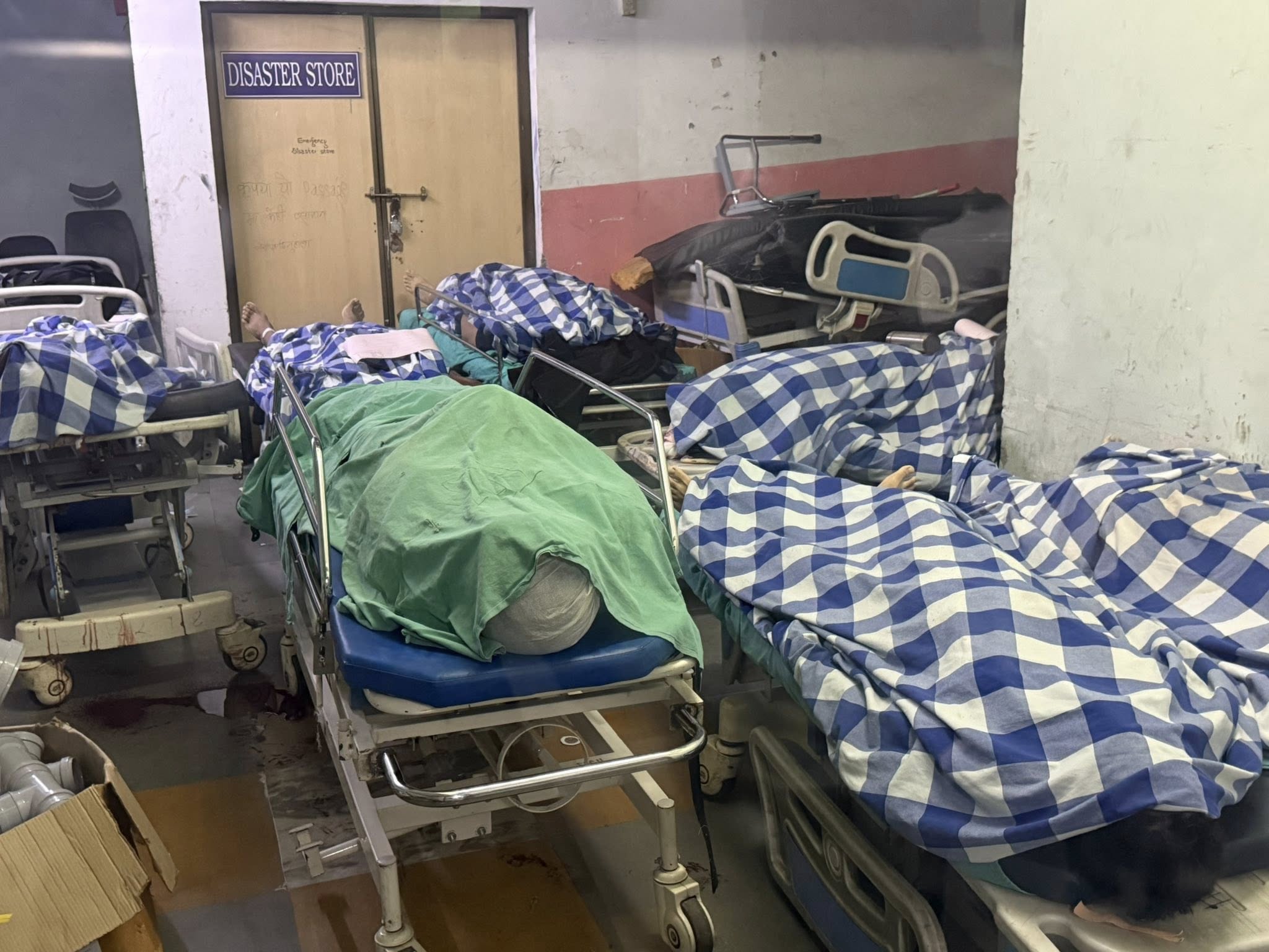 Students killed in September 8 protest - covered bodies in hospital